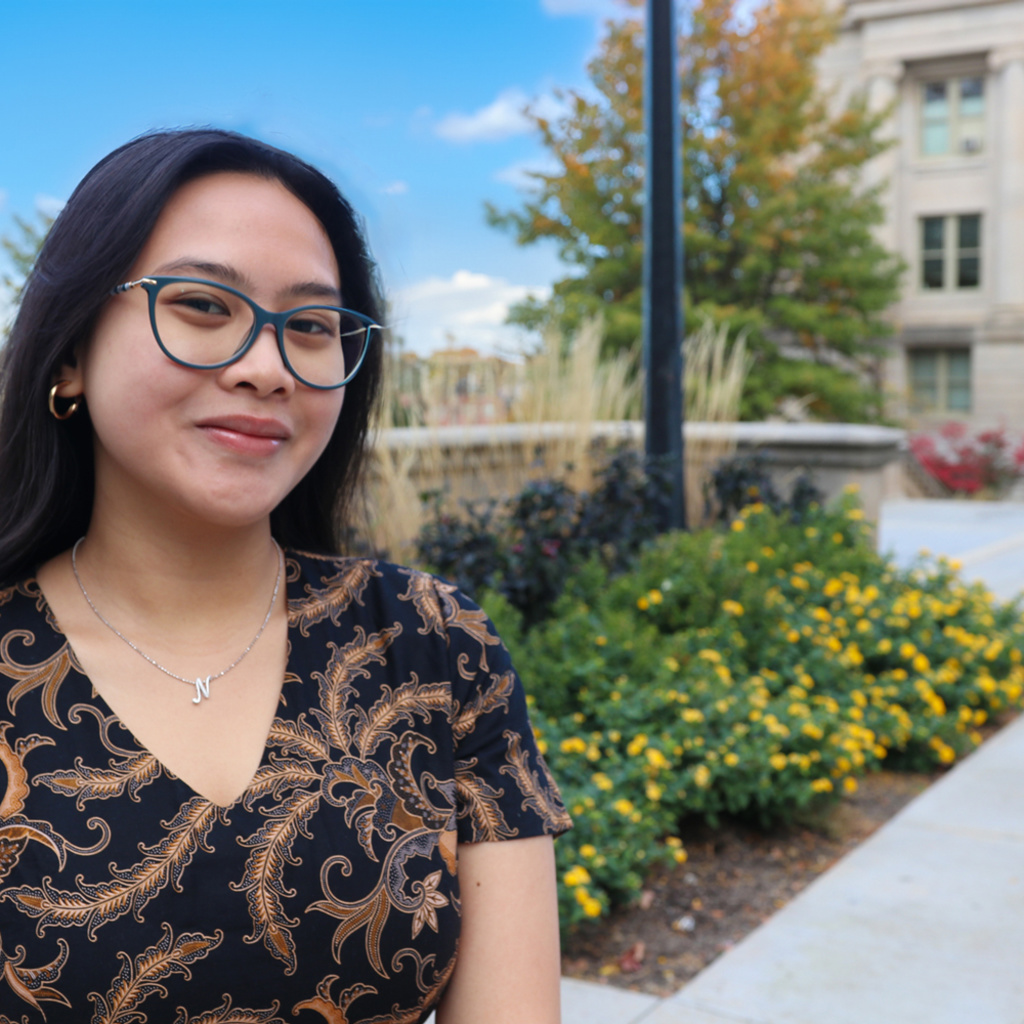 student posing for a photo and smiling
